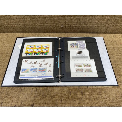 1057 - large folder of world stamps and mini sheets.