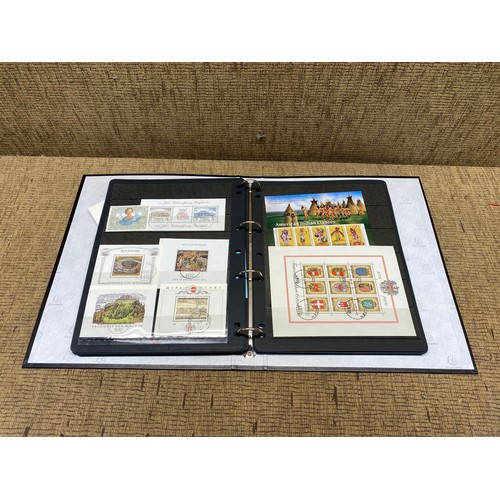 1057 - large folder of world stamps and mini sheets.