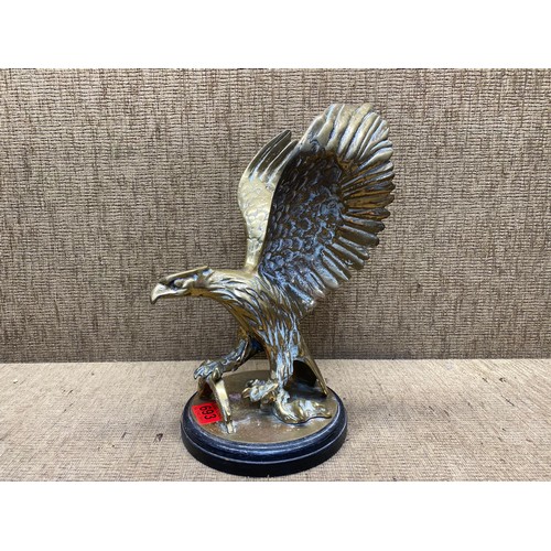 693 - Very heavy brass eagle on stand.