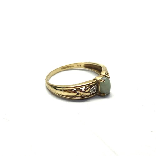 823 - 9ct gold ring, with Jade stone and kiss diamonds, size Q, 2.2g.