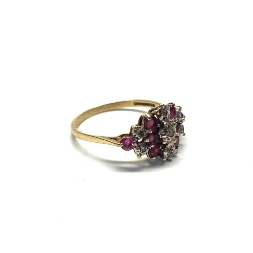 824 - 9ct gold cluster ring with diamonds and rubies.  Size Q. 2g.