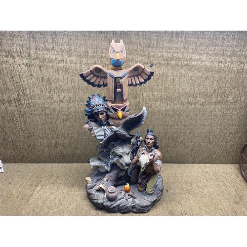 1098 - A resin native American Indian statue with toten pole.