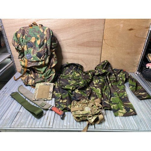 162 - Collection of army clothing and equipment including 2 lightweight combat jackets, machete and a ruck... 