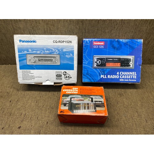 438 - Panasonic car radio, Goodmans  4- channel pll radio cassette and a car cassette carrier.