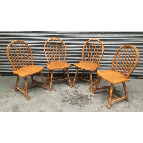 169 - Four pine spindle back chairs