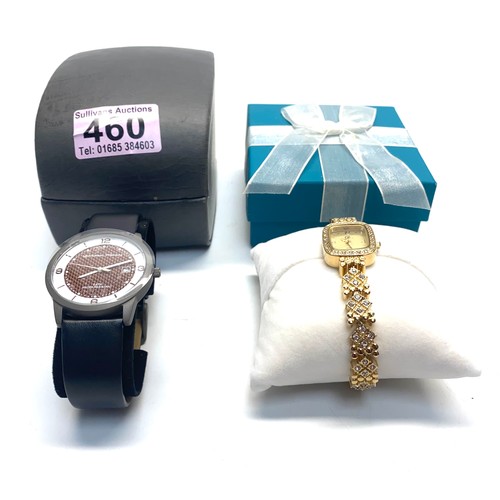 460 - Men's Universal Titanium watch and a D design jewel-encrusted ladies watch. (The watches are working... 