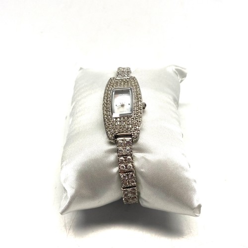 726 - Glitzy silver ladies' watch encrusted with crystals, mother of pearl face and small diamond by D*(Th... 