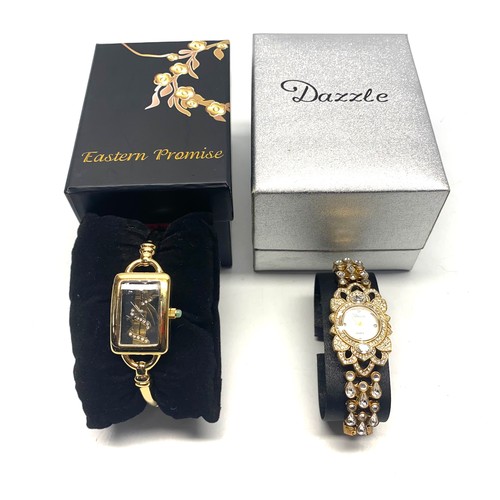 727 - Dazzle ladies' watch is crystal-encrusted and an Eastern Promise ladies' watch with a bill of sale.(... 