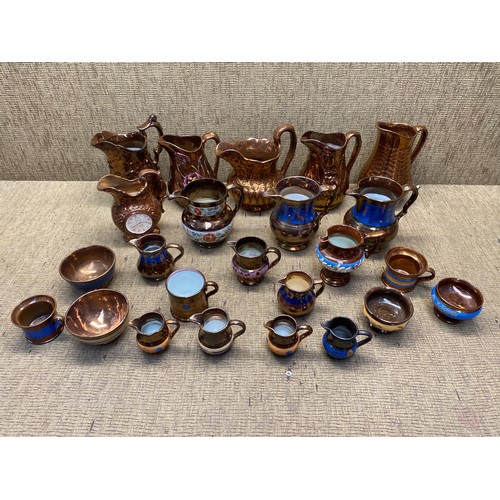 1158 - Large collection of different lustre jugs.