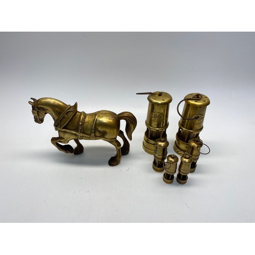 465 - 4 small brass lamps, 2 brass mining lamps, and 1 brass horse.