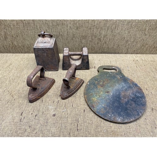 731 - vintage items including: Weights, irons and hot plate.