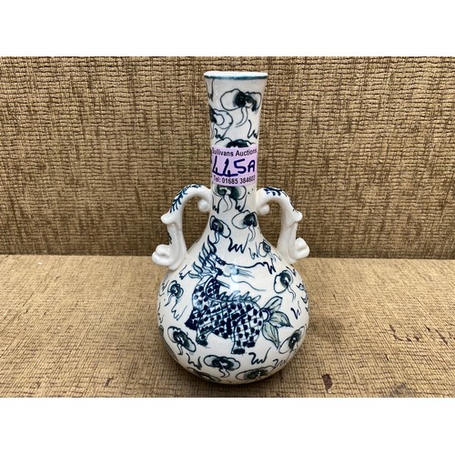 445A - Chinese hand painted blue and white dragon vase.