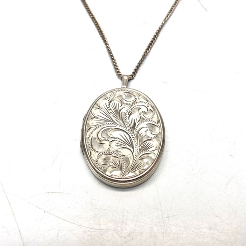 890 - Large Sterling silver locket and chain.