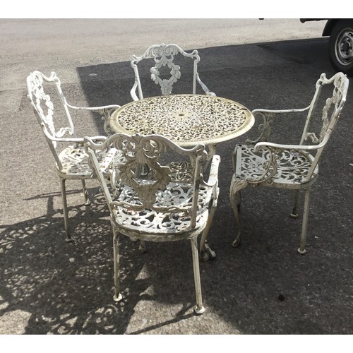 323 - set of cast aluminium chairs and table.