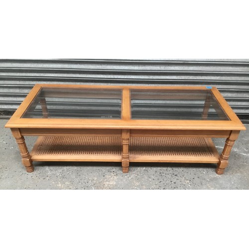 1196 - double glass top coffee table 130x54cm.