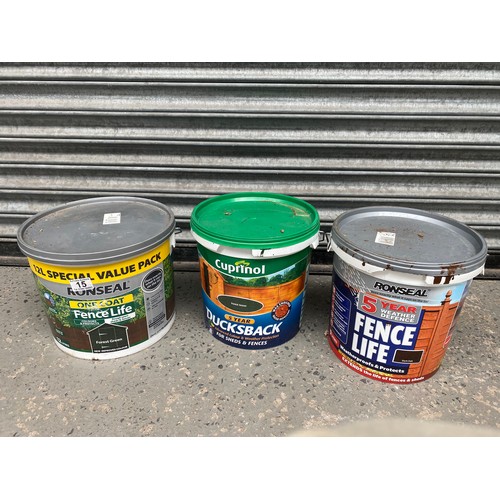 15 - Three containers of fence paint (3/4 and full)