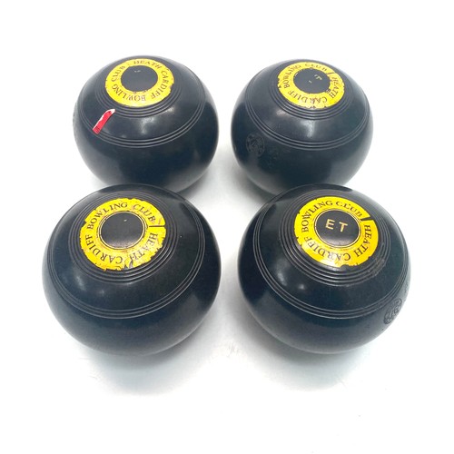614 - set of 4 vintage lawn bowls from the heath bowls club in Cardiff.