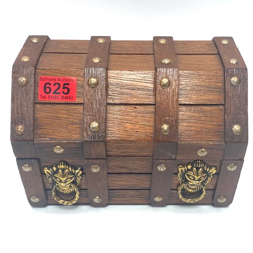 625 - Wooden treasure chest jewellery box with brass fittings; 18cm tall and 20cm wide.