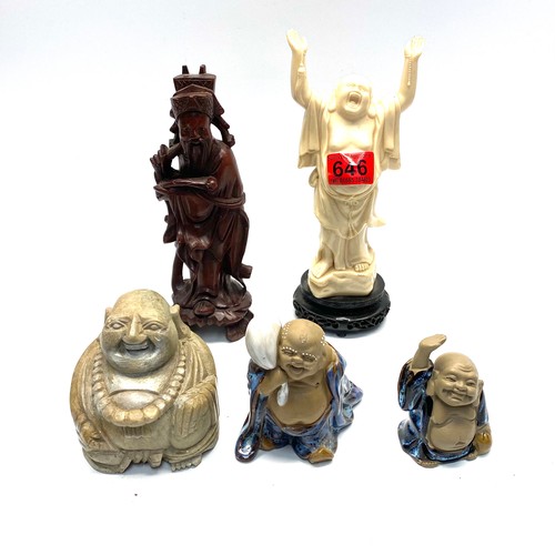 646 - Four laughing buddhas (white one made in Hong Kong) and a carved wood Chinese figure.