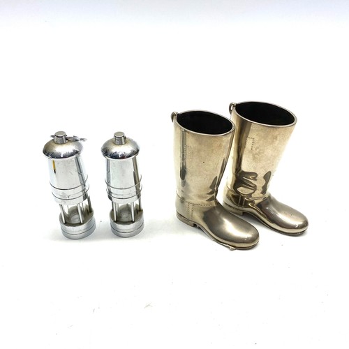 648 - A pair of small chrome mini mining lamps and a pair of riding boots.