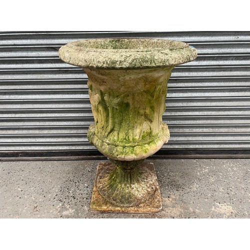 1013 - Composite stone garden urn on plinth 92x64cm.