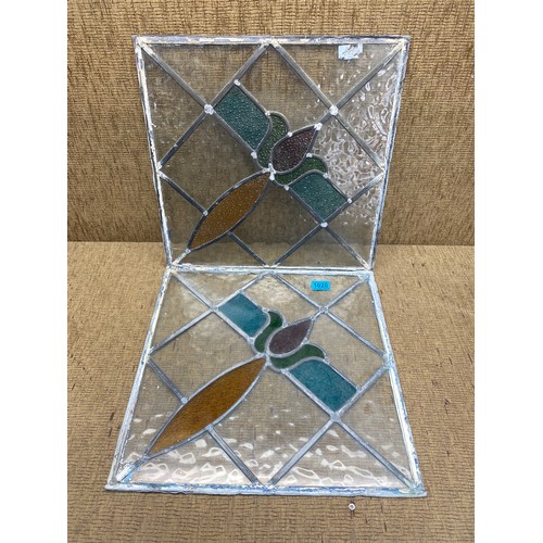 1028 - 2 vintage stained glass windows; 45cm x 45cm.