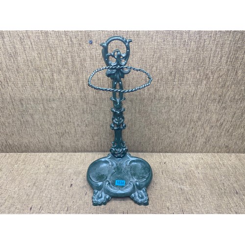 1034 - cast iron umbrella stand with drip tray; 58cm tall.