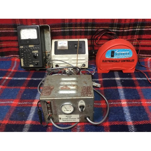 160 - Three vintage battery chargers and a voltmeter made in USSR