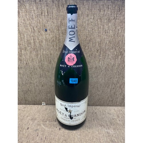 1048 - Brut imperial Moet chardonnay large bottle; 64cm tall.