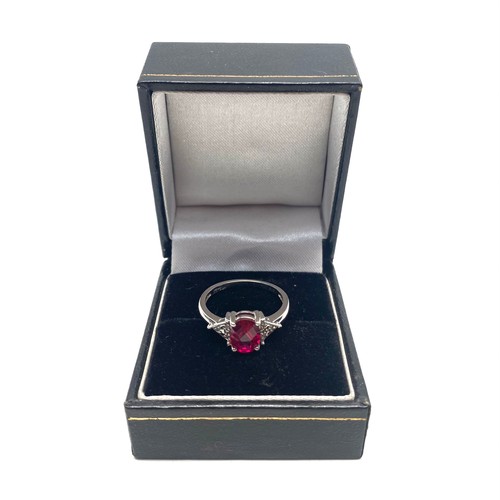 805 - 9ct White gold ring, size N. with a 1.67g Ruby with diamond shoulders. Complete with a certificate f... 