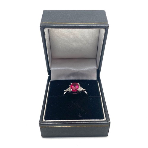 805 - 9ct White gold ring, size N. with a 1.67g Ruby with diamond shoulders. Complete with a certificate f... 