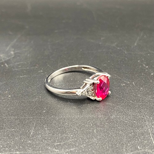 805 - 9ct White gold ring, size N. with a 1.67g Ruby with diamond shoulders. Complete with a certificate f... 