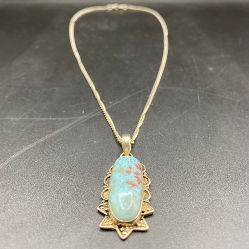 691 - Handmade blue Caribbean Larimar silver mounted pendant and chain.