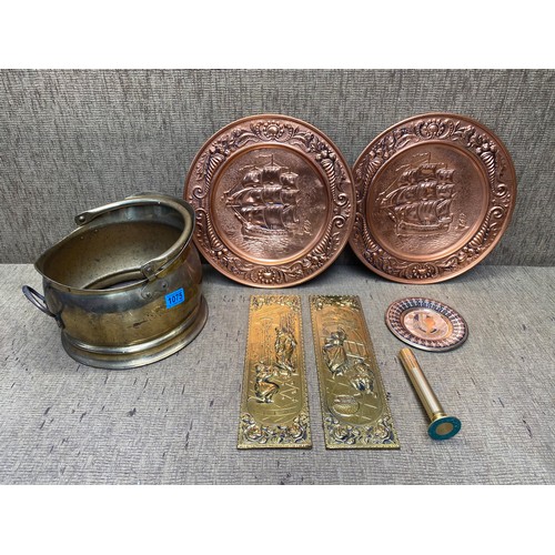 1075 - Brass coal scuttle and copper wall plate plaque.