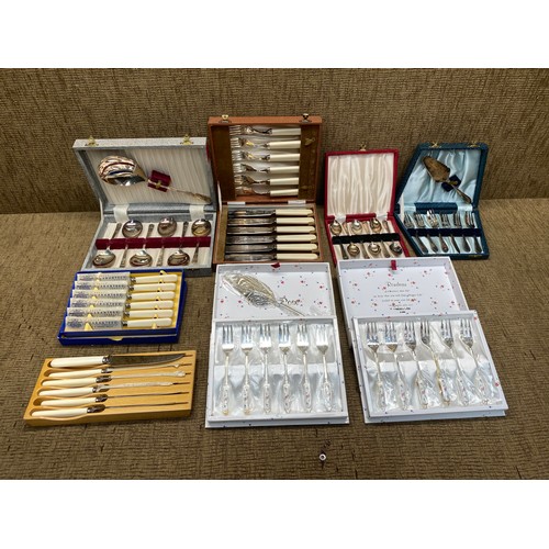 723 - collection of cutlery sets including simco artware silver plate soup spoon set.