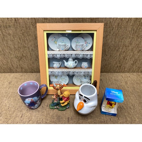 250 - framed miniature tea set and collection Disney items including winnie the pooh, frozen.