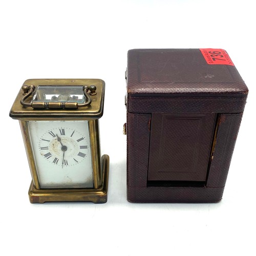 736 - Stunning vintage brass mechanical carriage clock with key and a leather bound case.