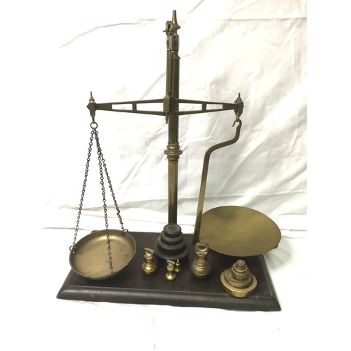 758 - A set of brass tobacco scales on a mahogany base 55cm x 45cm