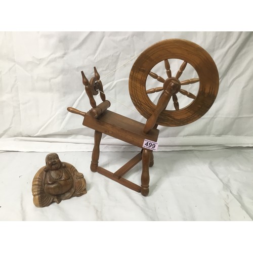 499 - Wooden spinning wheel 40cm and a wooden Buddha