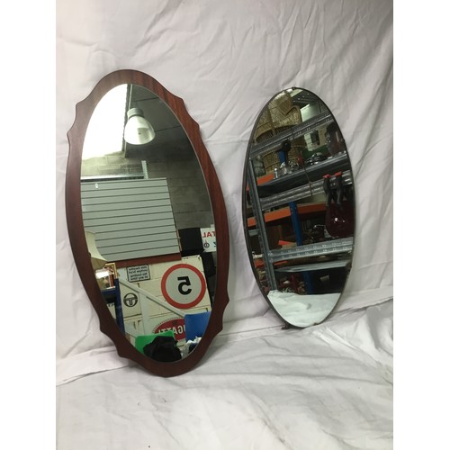 262 - Two oval framed mirrors largest one 76cm
