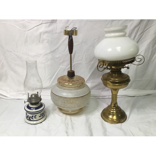 263 - Two oil lamps and a pendant light with shade