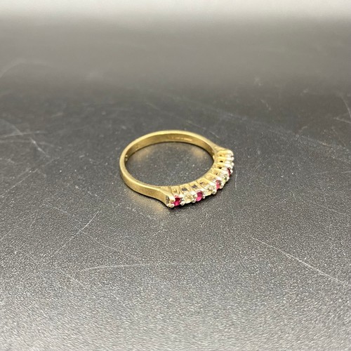 867 - 9ct gold ring with rubies and CZ. Size N. 1.7g.