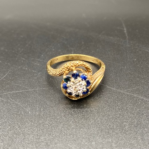 868 - 9ct gold, diamond and green sapphire flower ring. 4g and size R.