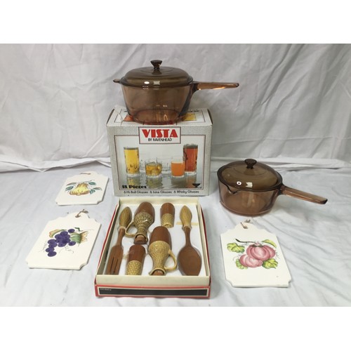 264 - An 18 piece boxed glass set, two vision saucepans and a condiment set