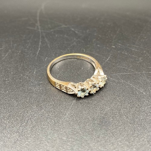 869 - 9ct gold and three diamond ring. Size N, 2.8g.