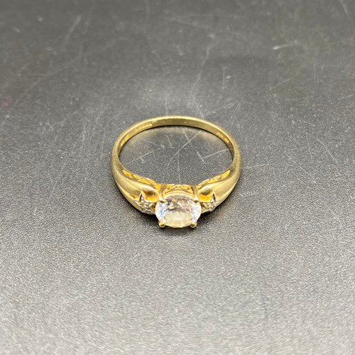 872 - 14ct gold ring with large CZ stone and two diamonds to the shoulders. Size U and 3.4g.