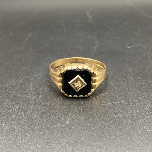 874 - 9ct gold Onyx and diamond ring. Size T and 2.4g.