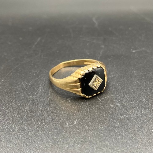 874 - 9ct gold Onyx and diamond ring. Size T and 2.4g.