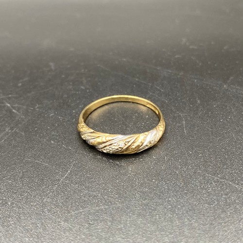 879 - 9ct gold rope ring with diamonds, size O and 1.7g.