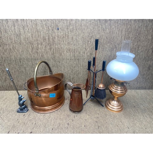 1122 - Antique copper coal scuttle with fire side compendium and a copper vintage oil lantern.